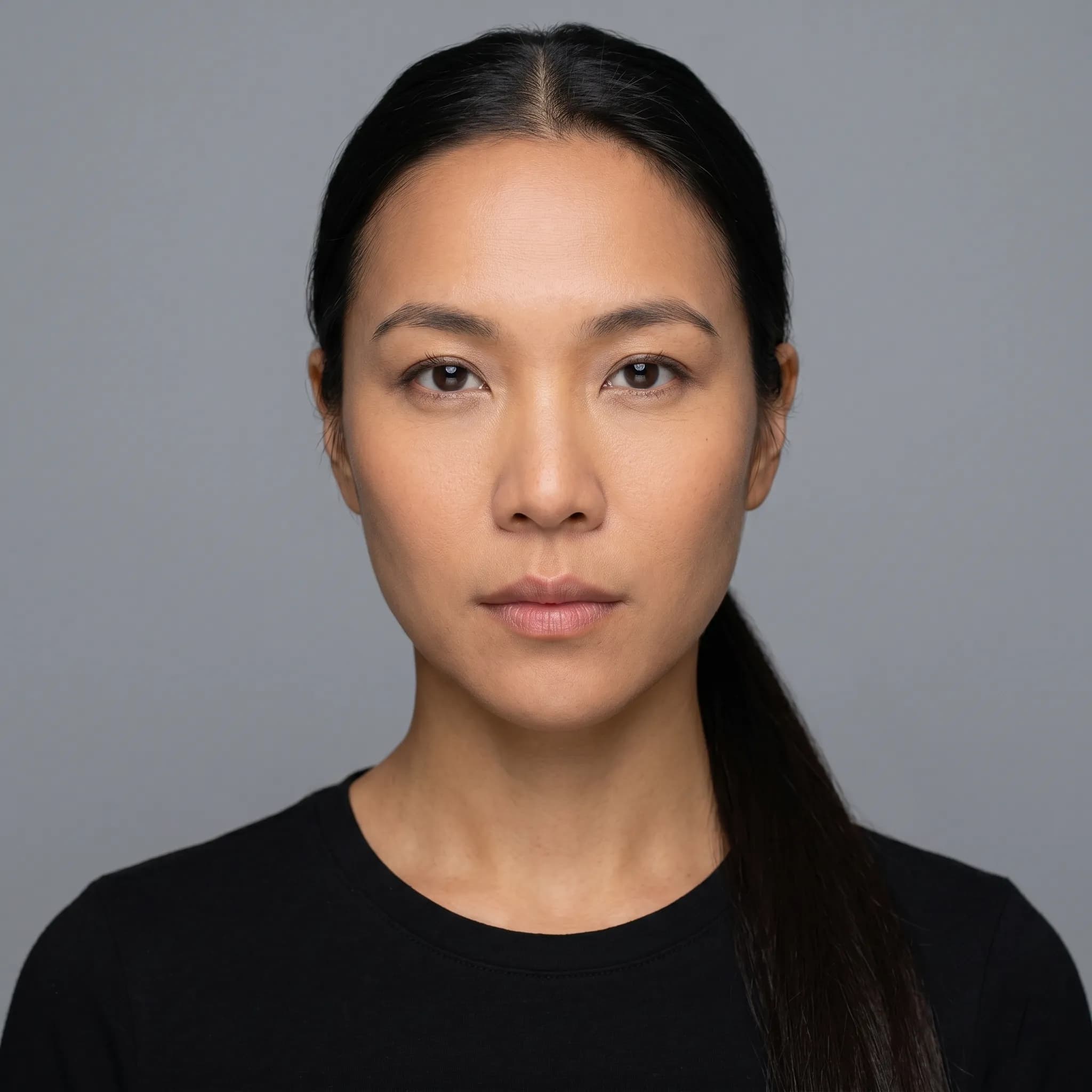 Look directly at the camera with a neutral or smiling expression. Ensure your face is well-lit and not obstructed.